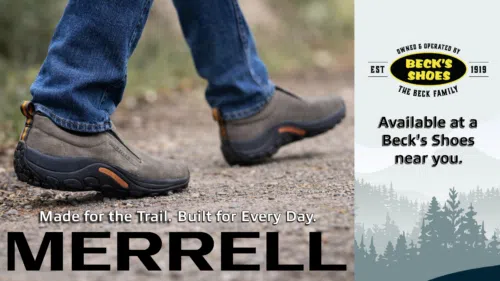 Merrell Jungle Moc slip-on hiking shoes for men worn on a gravel trail, offering everyday comfort and trail-ready support, available at Beck’s Shoes