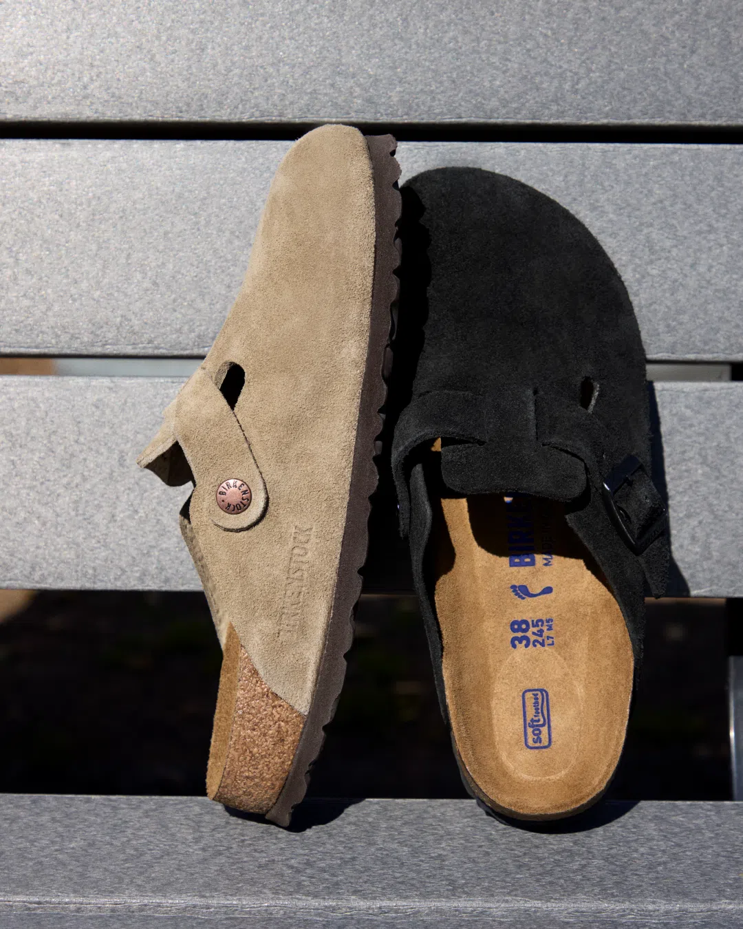 Taupe and Black Birkenstock Boston Soft Footbed clogs displayed together on a bench.