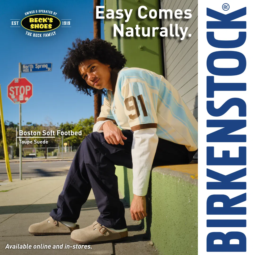 Model seated outdoors wearing Taupe Birkenstock Boston Soft Footbed clogs.